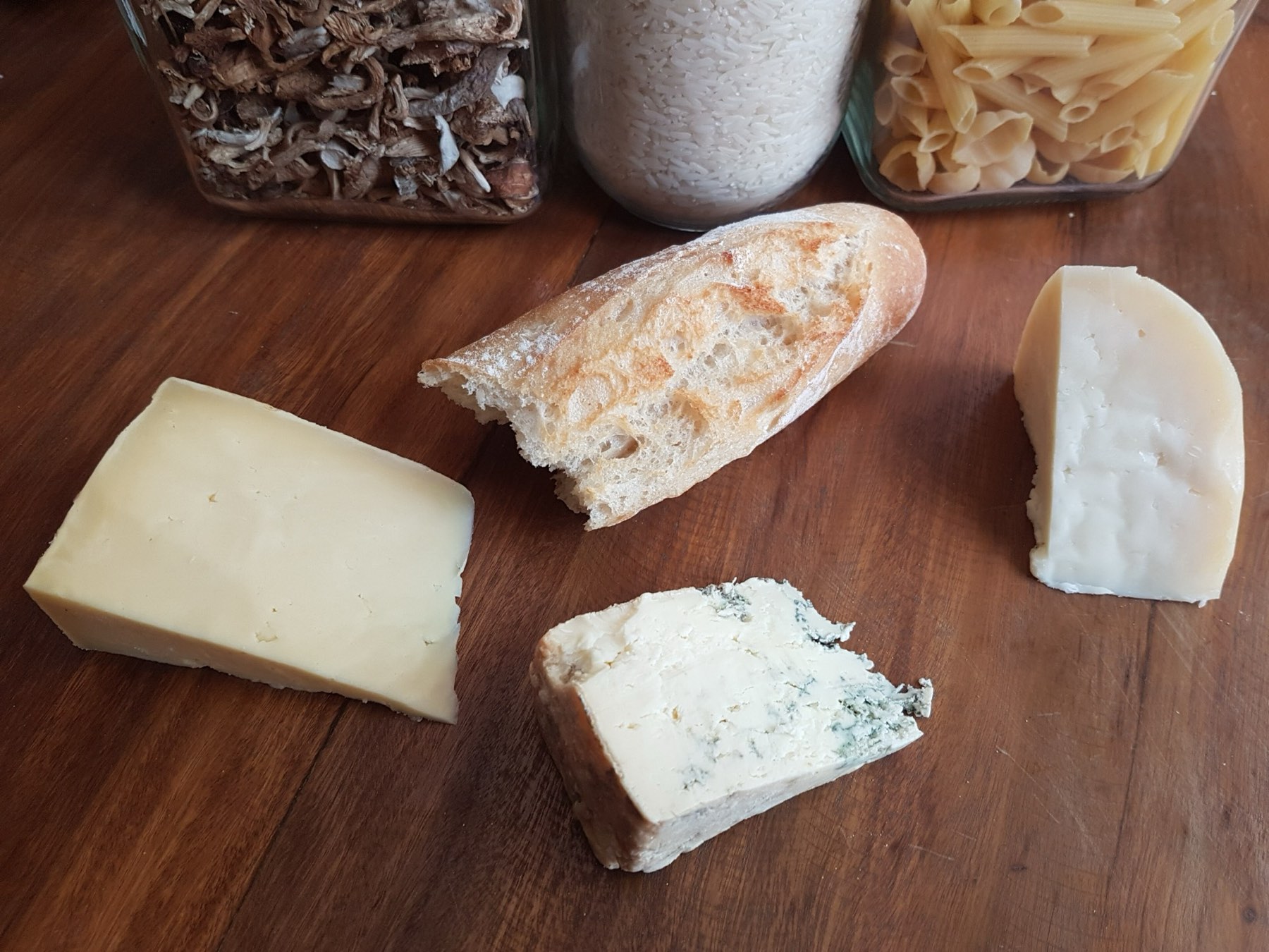 Wedges of Brown's cheese, including a blue cheese, on a wooden board
