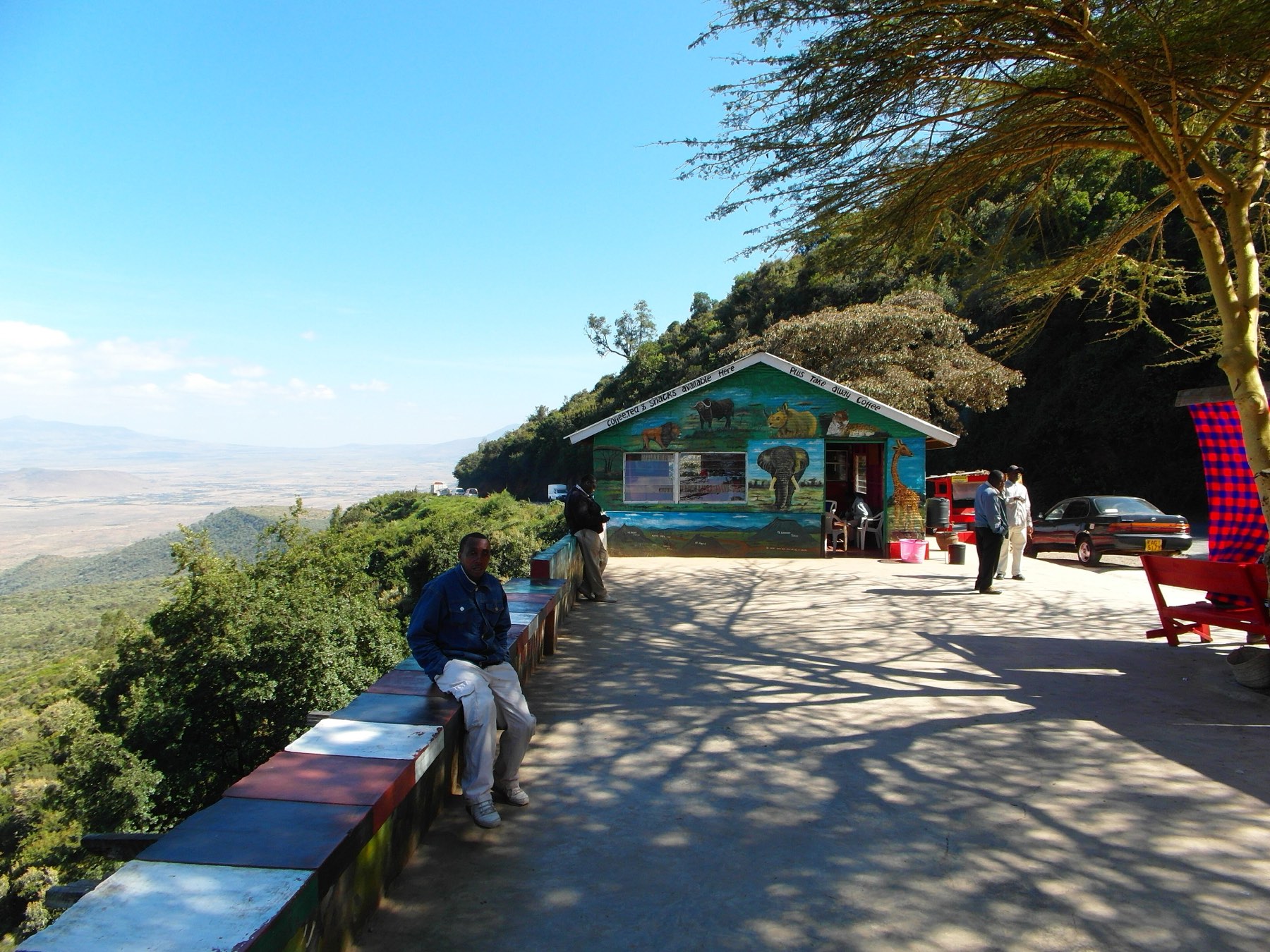A viewpoint terrace with curio stalls overlooking the floor of the Great Rift Valley